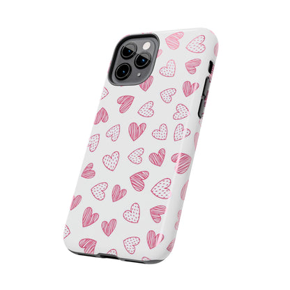 Cute seamless pattern with pink doodle hearts. Tough Phone Cases